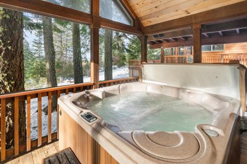 a jacuzzi tub on the deck of a house at The Cabins at Hyatt in Ashland