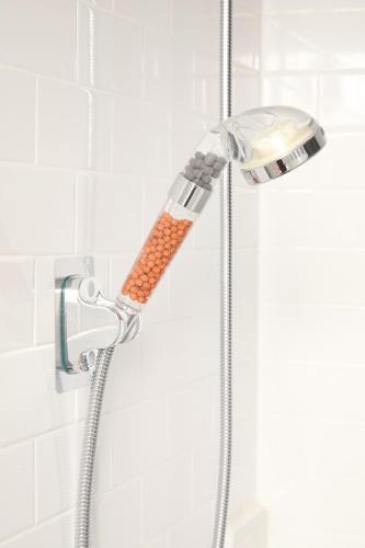 a shower with a shower head in a bathroom at Private Loft in Hells Kitchen near Times Square in New York