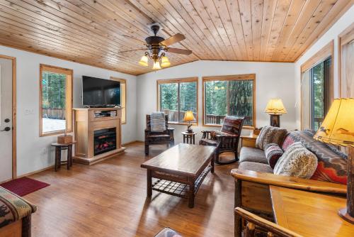 a living room with a couch and a table at The Cabins at Hyatt in Ashland