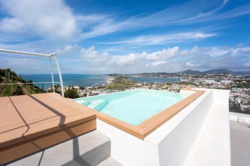 a swimming pool on the roof of a house at Lavinum in Monte di Procida