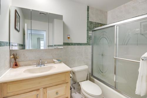 a bathroom with a toilet and a sink and a shower at Family-Friendly Home in Bowie with Fenced Yard! in Bowie