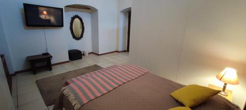 Ένα ή περισσότερα κρεβάτια σε δωμάτιο στο Flying Dog Hostel Arequipa