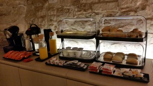 two trays of food sitting on top of a counter at MoMa B&B Molfetta Mare in Molfetta