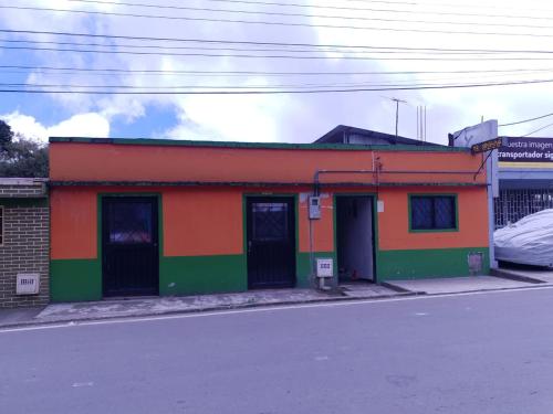 a colorful building on the side of a street at Hostal Perla Del Norte in Murillo