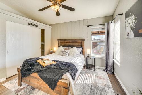 a bedroom with a bed and a ceiling fan at Covered Patio Lincoln Vacation Rental! in Lincoln