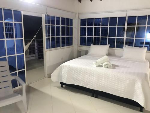 Ένα ή περισσότερα κρεβάτια σε δωμάτιο στο Hotel Punta Piedra