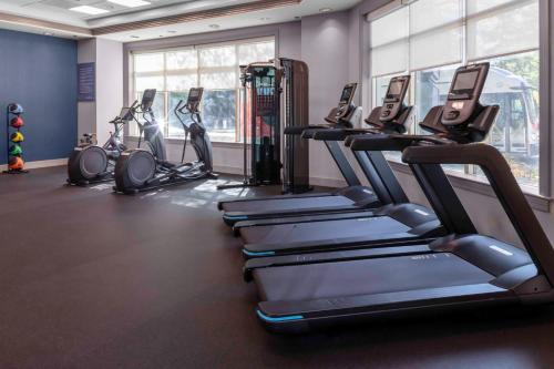 a gym with several treadmills and elliptical machines at Hampton Inn & Suites Arlington Crystal City DCA in Arlington