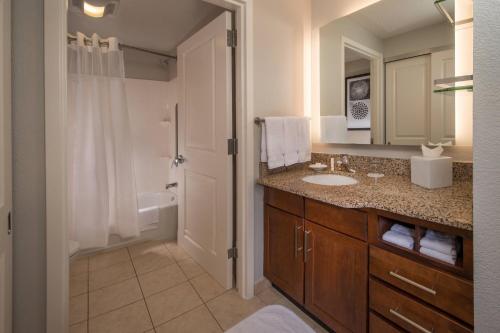 a bathroom with a sink and a toilet and a shower at Residence Inn Dulles Airport At Dulles 28 Centre in Sterling