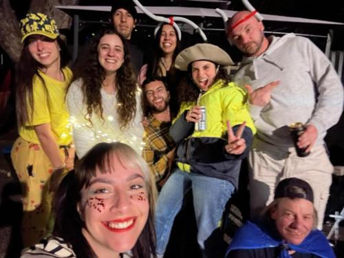 a group of people posing for a picture at a party at Gonow Family Backpackers Hostel in Brisbane