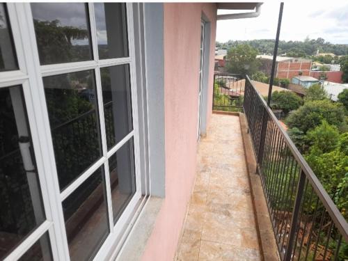 a balcony of a house with a view of a yard at Residencial GM in San Vicente