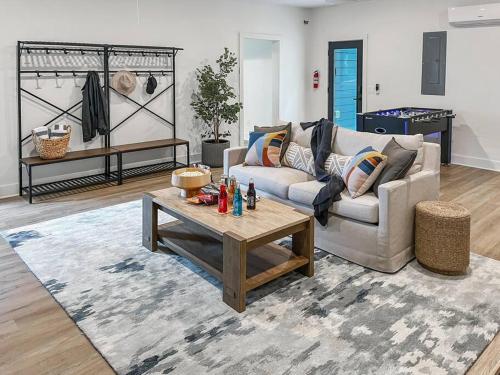 a living room with a couch and a coffee table at Leo's Bear Lake Hideaway in Kalkaska