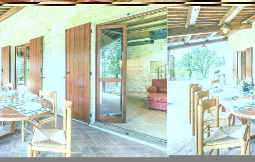 a dining room with a table and a glass door at Collonico in Stroncone