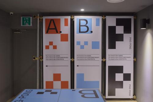 a room with two doors with a bunch of squares at Aank Hotel Seoul Sinchon in Seoul