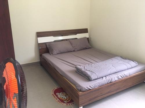 a bed in a small room with at DAT THAM Beach - Con Dao National Park in Con Dao