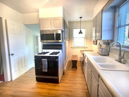 a kitchen with a stove and a sink at Bogus Property in Salt Lake City