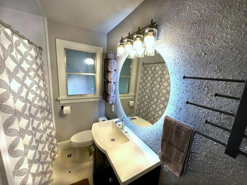 a bathroom with a sink and a mirror at Bogus Property in Salt Lake City