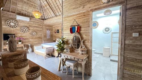 a living room with a wooden wall at Kubu Dimel Suites and Villas Resort in Nusa Dua