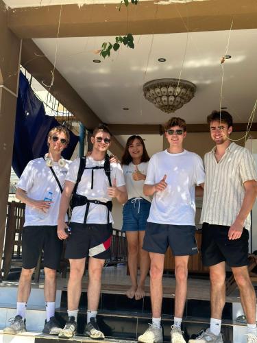 a group of people posing for a picture at Vang Vieng Global Hostel in Vang Vieng