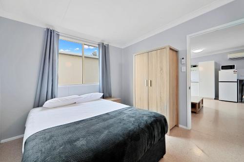 Ένα ή περισσότερα κρεβάτια σε δωμάτιο στο Ned Kelly's Motel