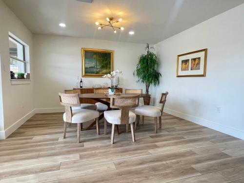 a dining room with a table and chairs at Gorgeous waterfront home on the St. Johns River in Osteen