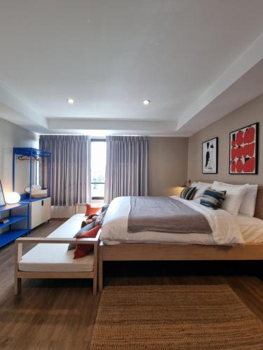 Llit o llits en una habitació de LAZYDAY IN NIMMAN