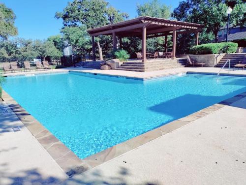 a large swimming pool with a gazebo at Convenient location in upscale city of Southlake. in Southlake