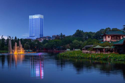 a view of a river with a building in the background at CYNN XANADU Hotel Chengdu in Chengdu