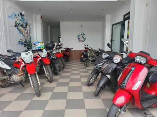 a row of motorcycles parked in a room at RUBY HOTEL Vĩnh Long in Vĩnh Long