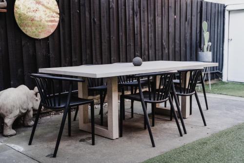 a table and chairs with a ball on top of it at Your home on Smith St Collingwood Melbourne with parking in Melbourne