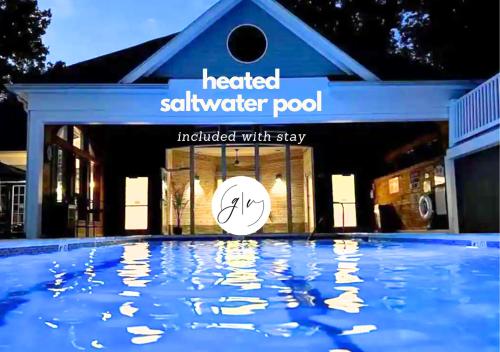 a house with a swimming pool in front of it at Luxury Villa- 3 mins to Mohegan- Fully Stocked with Fireplace- Jacuzzi, Saltwater Pools, Sauna in Norwich