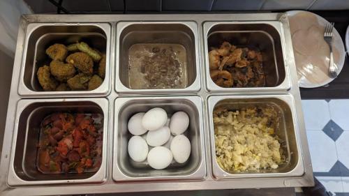 a plastic container filled with food on a table at Eileen Hotel Cairo in Cairo