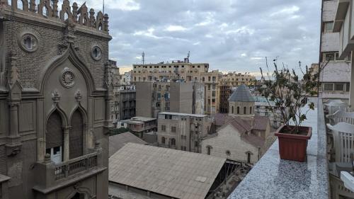 a view of a city from a balcony of a building at Eileen Hotel Cairo in Cairo