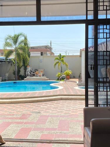 a view of a swimming pool from a house at Valle Suites, la Mejor Ubicación in Valledupar