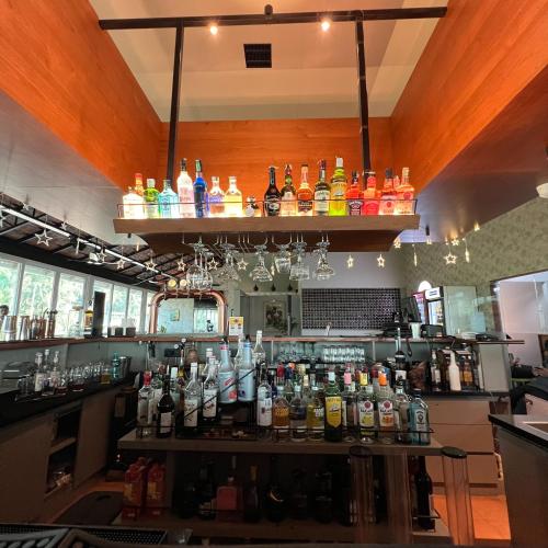 a bar with a lot of bottles of alcohol at PEARL MAHE in Mahe