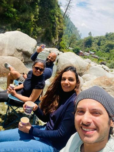 a group of people posing for a picture at Kudrat - A Boutique Homestay- Tirthan Valley in Banjār