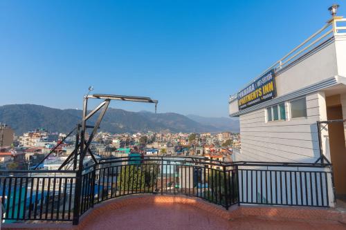 a balcony of a building with a view of a city at POKHARA APARTMENTS INN in Pokhara