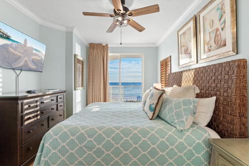 a bedroom with a bed and a ceiling fan at Gulfside 402 - True Luxury BEACHFRONT at Destin West - Best View in the Resort! in Fort Walton Beach