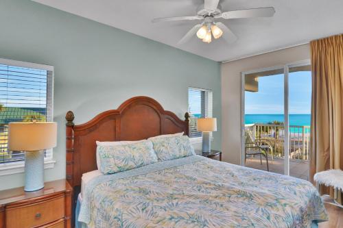 een slaapkamer met een bed en een balkon met uitzicht op de oceaan bij Destin West Gulfside 301 - True Beachfront Luxury - Beautiful Views! in Fort Walton Beach