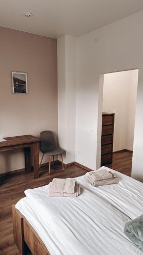 Ένα ή περισσότερα κρεβάτια σε δωμάτιο στο Hotel Dovha