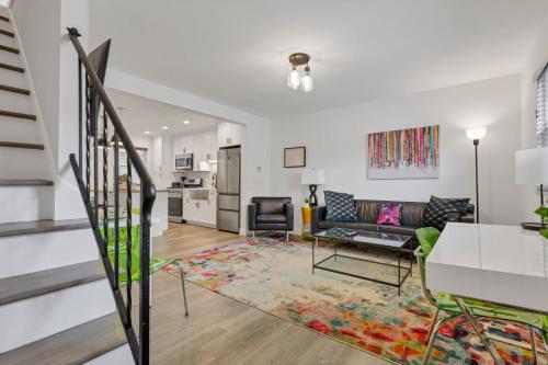 a living room with a couch and a table at The Worthington - 3 BR 2 5 Bath and Parking in Columbus