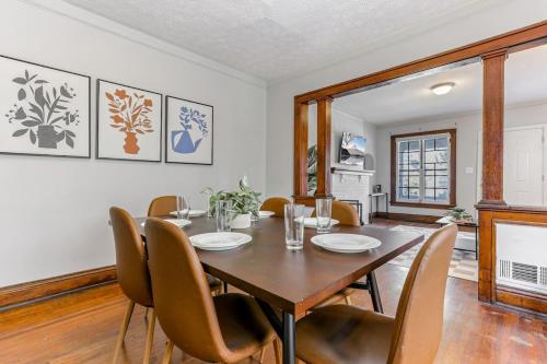 a dining room with a table and chairs at The Champion Abode 2 in Columbus