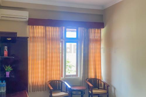 Гостиная зона в Hannie House RedPartner near Jalan Ahmad Yani Banjarmasin