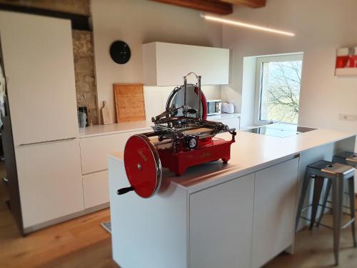 a red machine sitting on top of a kitchen counter at Relais Poggio Pagnan in Farra