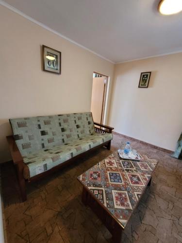 a living room with a couch and a table at Гостиница ИЛЕК in Aktobe