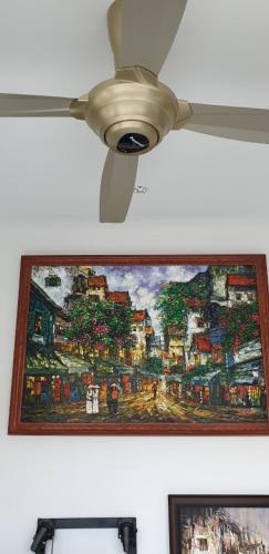 a ceiling fan hanging from a ceiling at The Dragon Villa Hoi An in Hoi An