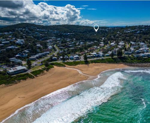 an aerial view of a beach with a white object in the air at Copa Sunset Surprise - Modern and Stylish Simplicity in Copacabana
