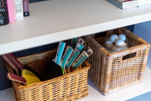 two baskets on a shelf with eggs in them at Copa Sunset Surprise - Modern and Stylish Simplicity in Copacabana