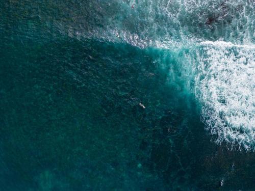 an overhead view of a wave in the ocean at Copa Sunset Surprise - Modern and Stylish Simplicity in Copacabana