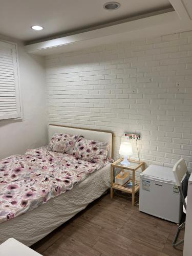 Ένα ή περισσότερα κρεβάτια σε δωμάτιο στο Hostel Seoul