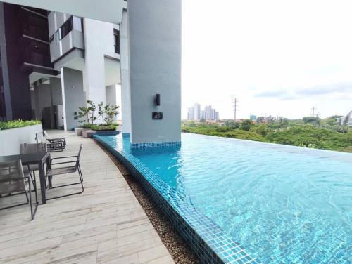 a swimming pool in the middle of a building at Tropicana Golf view 7pax -1 Utama - Ikea -The Curve in Petaling Jaya